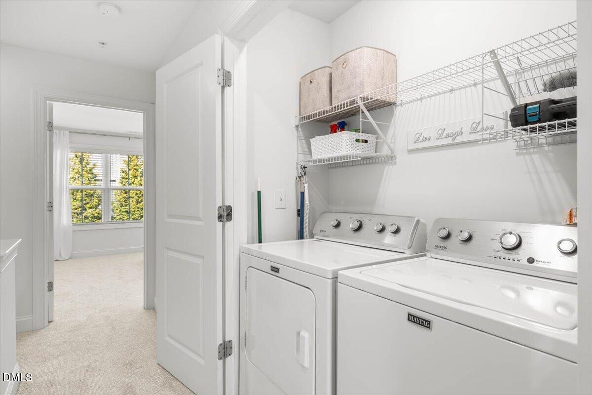 6810 Milligan Way, Unit 103 Raleigh, NC 27613 - Photo 30 of 37 a utility room with dryer and washer