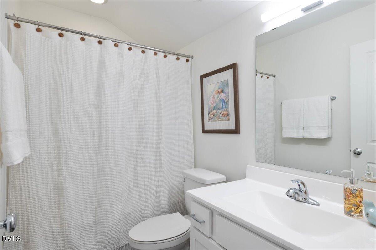 6810 Milligan Way, Unit 103 Raleigh, NC 27613 - Photo 33 of 37 a bathroom with a sink and a toilet