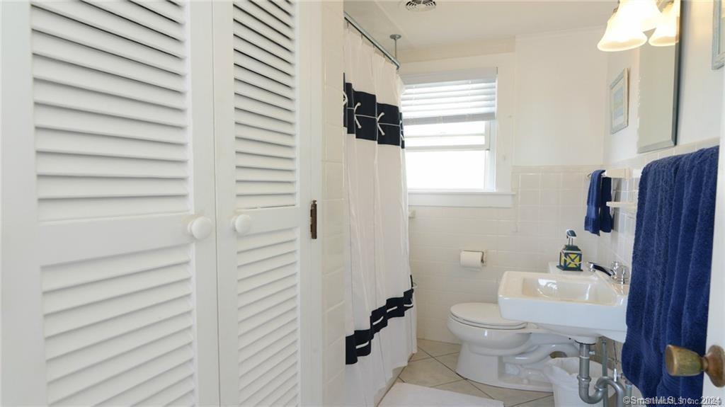 10 Weston Road Groton, CT 06340 - Photo 15 of 37 a bathroom with a toilet and a shower