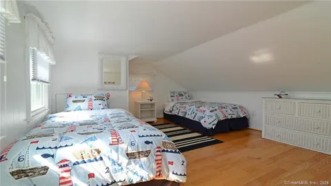 a view of an ocean with a floor to ceiling window