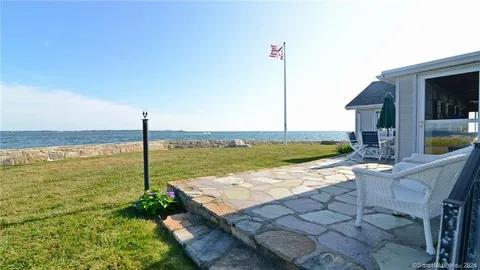 a view of an ocean beach and city