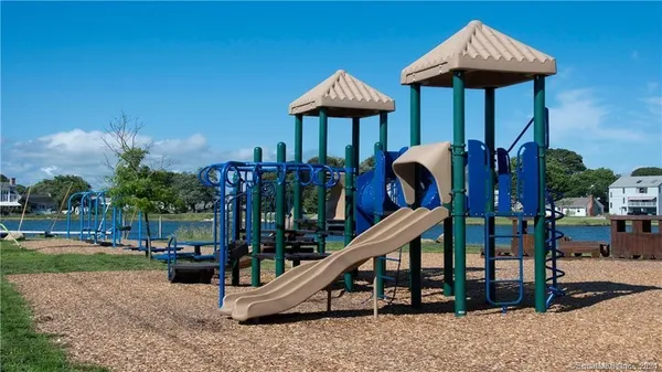 a view of a swimming pool with lounge chair