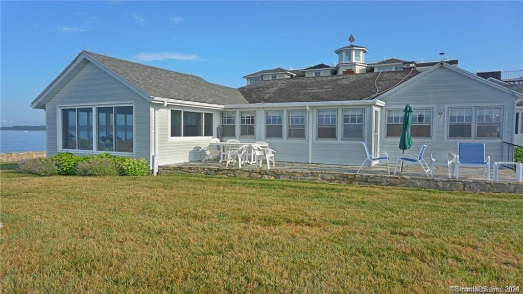 10 Weston Road Groton, CT 06340 - Photo 3 of 37 a front view of house with yard barbeque and outdoor seating