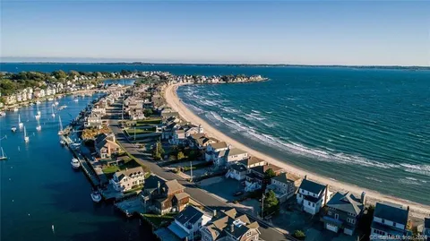 a view of a wooden bench with a wooden fence