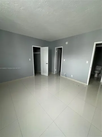 a view of a pathway with a yard