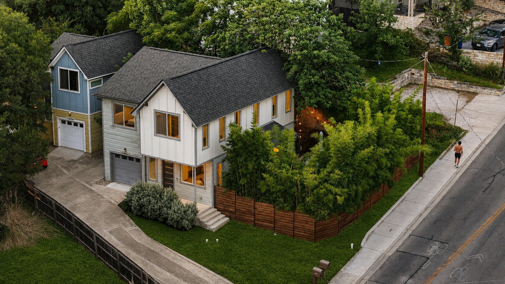 A well-maintained lawn and verdant landscaping enhance this contemporary residence.