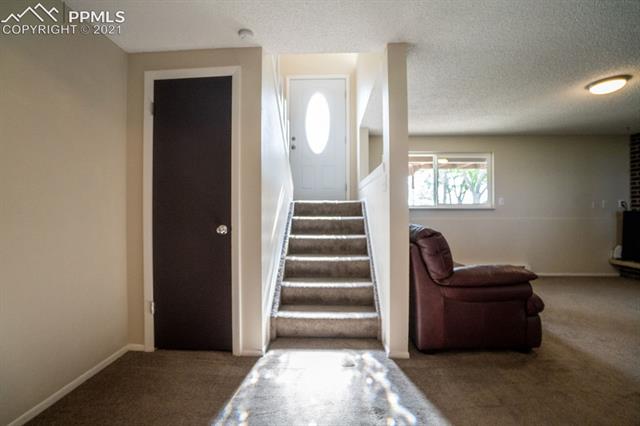 1315 Slocum Road Colorado Springs, CO 80930 - Photo 19 of 37 Stairway to Lower Level