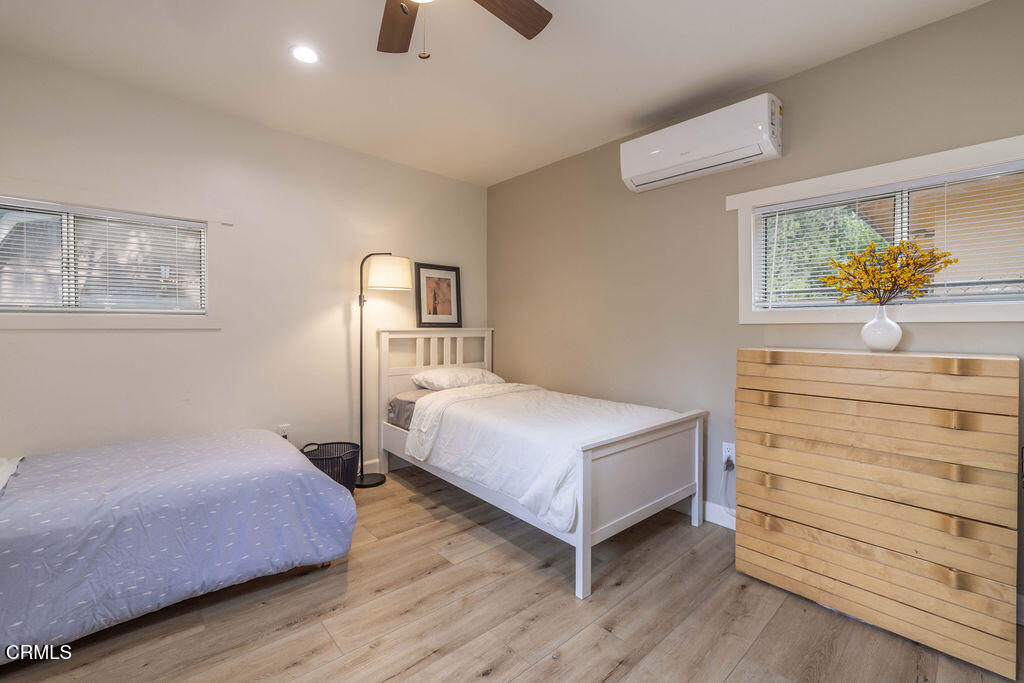 851 Pine Knot Avenue Big Bear Lake, CA 92315 - Photo 20 of 27 a bedroom with a bed and window