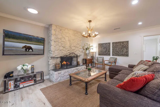 a living room with furniture and a fireplace