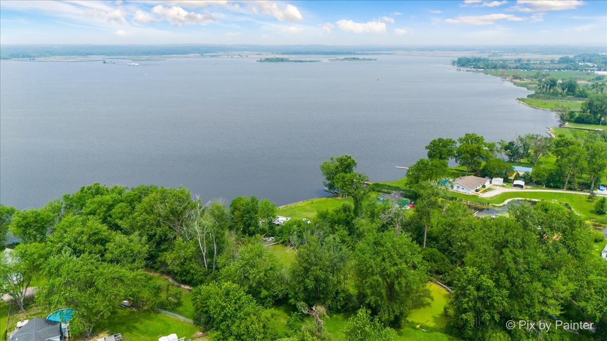 39203 Rangers Way Antioch, IL 60002 - Photo 9 of 11 a view of a lake with a yard
