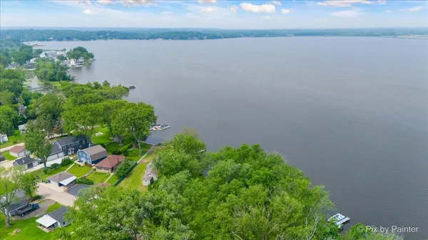 a view of lake with green space