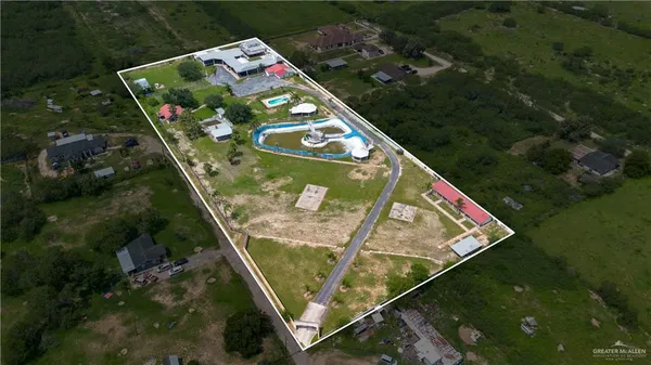 an aerial view of a house with outdoor space swimming pool and outdoor seating
