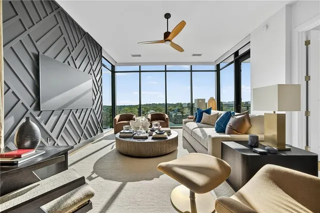 a living room with furniture and a large window