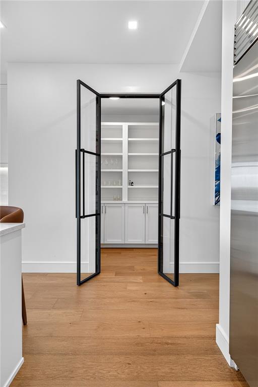 2520 Peachtree Road Northwest, Unit 903 Atlanta, GA 30305 - Photo 14 of 62 a view of empty room with wooden floor and cabinet