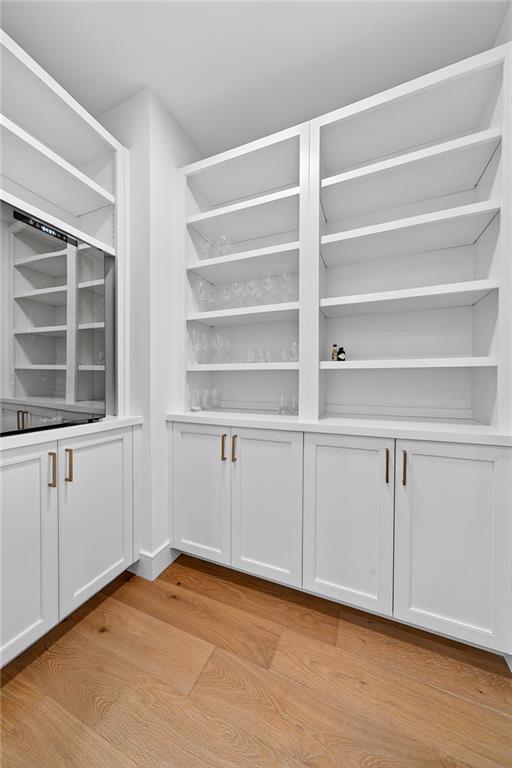 2520 Peachtree Road Northwest, Unit 903 Atlanta, GA 30305 - Photo 15 of 62 a view of an empty room with a window and wooden floor