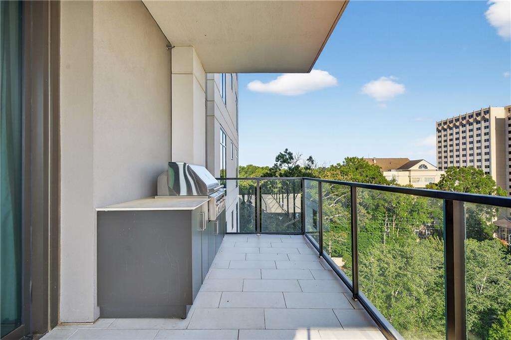 2520 Peachtree Road Northwest, Unit 903 Atlanta, GA 30305 - Photo 17 of 62 a view of a balcony with furniture