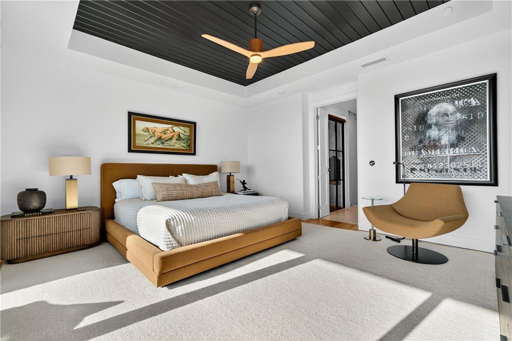 2520 Peachtree Road Northwest, Unit 903 Atlanta, GA 30305 - Photo 21 of 62 a spacious bedroom with a bed and a couch