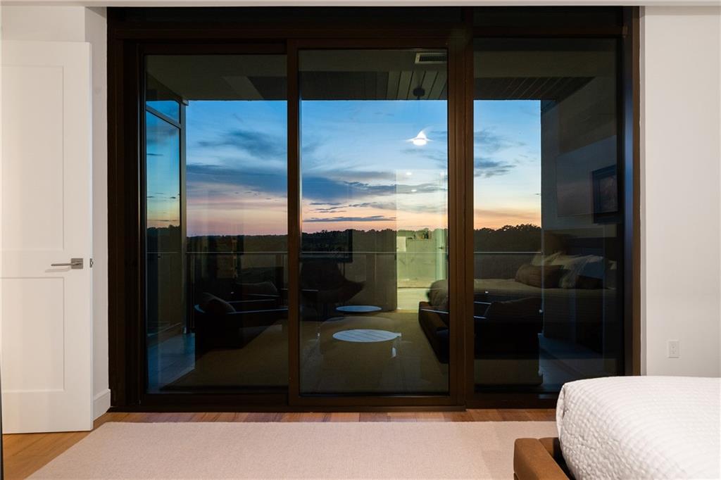 2520 Peachtree Road Northwest, Unit 903 Atlanta, GA 30305 - Photo 22 of 62 a bathroom with a glass shower door