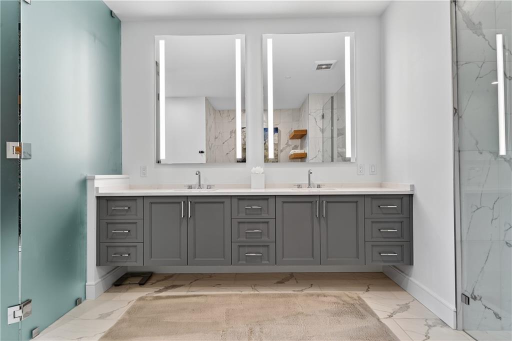 2520 Peachtree Road Northwest, Unit 903 Atlanta, GA 30305 - Photo 24 of 62 a bathroom with a sink vanity and mirror