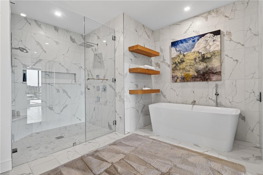 2520 Peachtree Road Northwest, Unit 903 Atlanta, GA 30305 - Photo 25 of 62 a bathroom with a bathtub and a shower