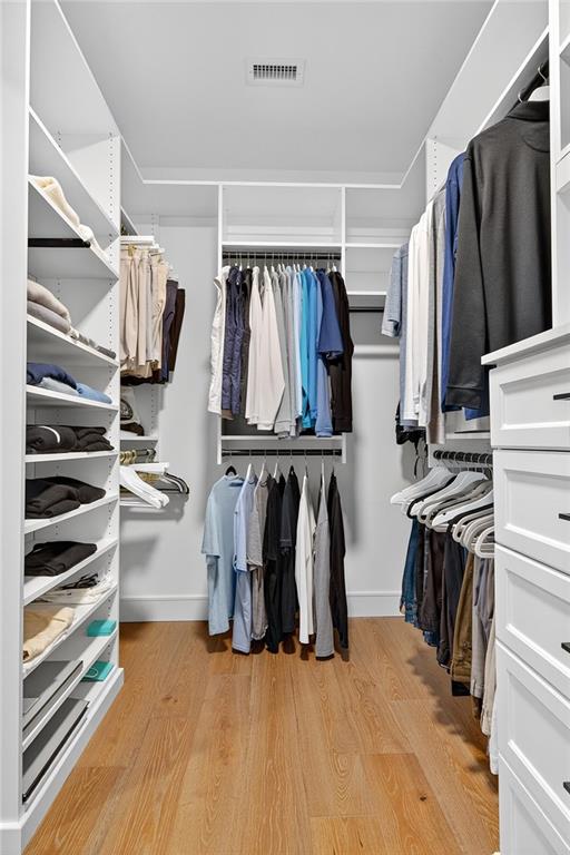 2520 Peachtree Road Northwest, Unit 903 Atlanta, GA 30305 - Photo 28 of 62 a view of walk in closet with clothes and shoes