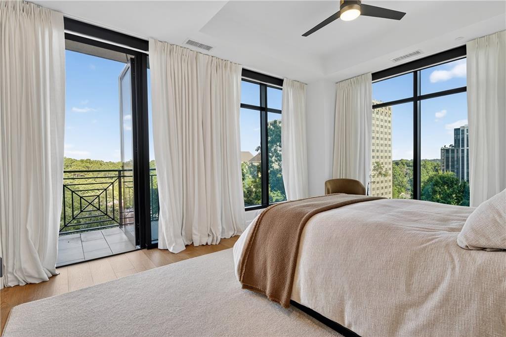 2520 Peachtree Road Northwest, Unit 903 Atlanta, GA 30305 - Photo 30 of 62 a bedroom with a bed and a large window