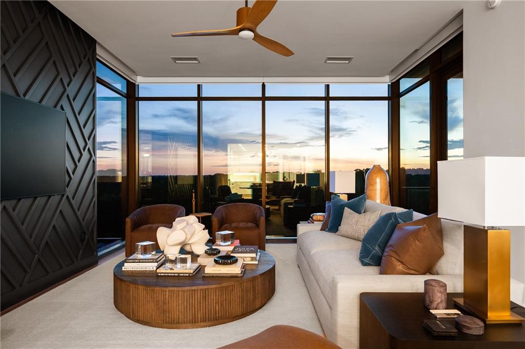 2520 Peachtree Road Northwest, Unit 903 Atlanta, GA 30305 - Photo 3 of 62 a living room with furniture and a large window