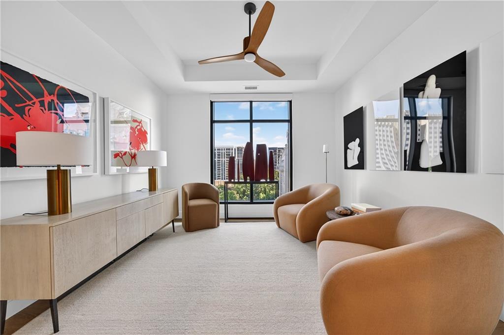 2520 Peachtree Road Northwest, Unit 903 Atlanta, GA 30305 - Photo 36 of 62 a living room with furniture ceiling fan and a window