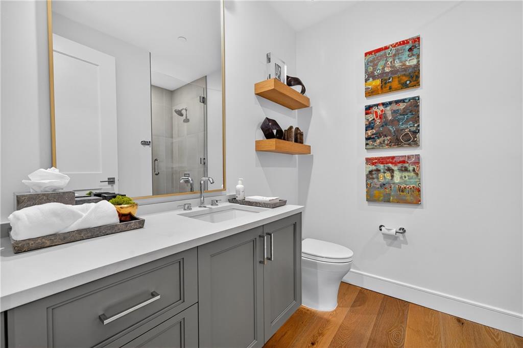 2520 Peachtree Road Northwest, Unit 903 Atlanta, GA 30305 - Photo 38 of 62 a bathroom with a sink a toilet and a mirror