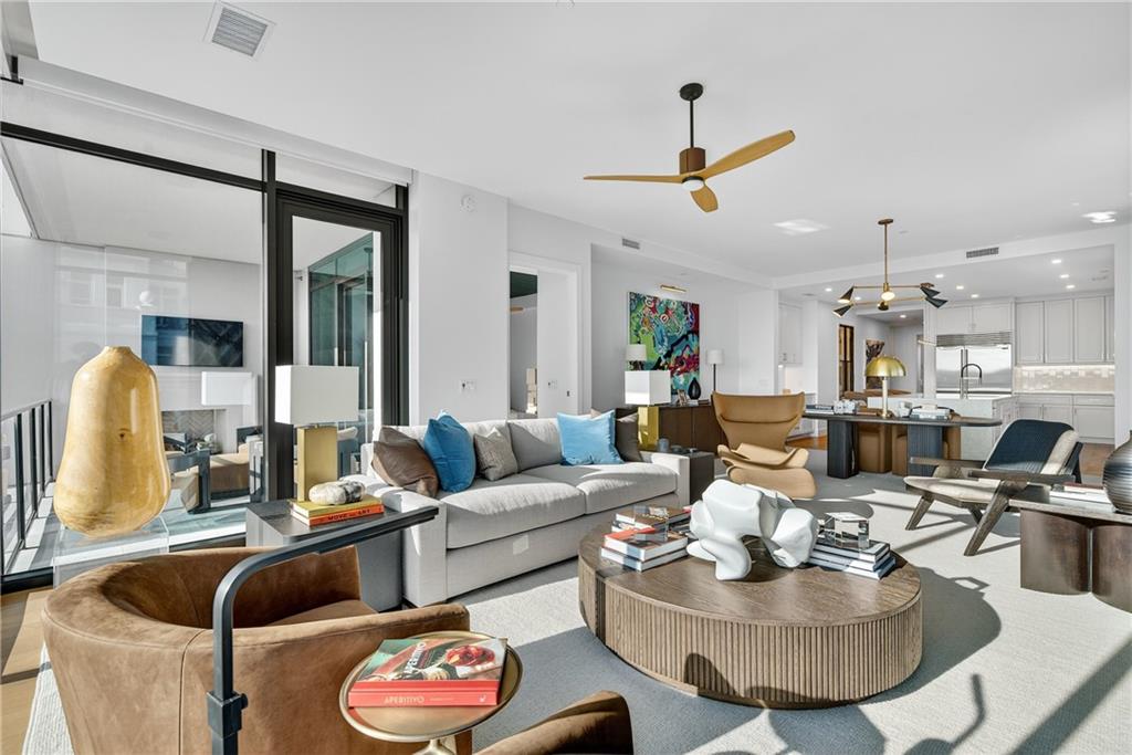 2520 Peachtree Road Northwest, Unit 903 Atlanta, GA 30305 - Photo 4 of 62 a living room with furniture and a large window