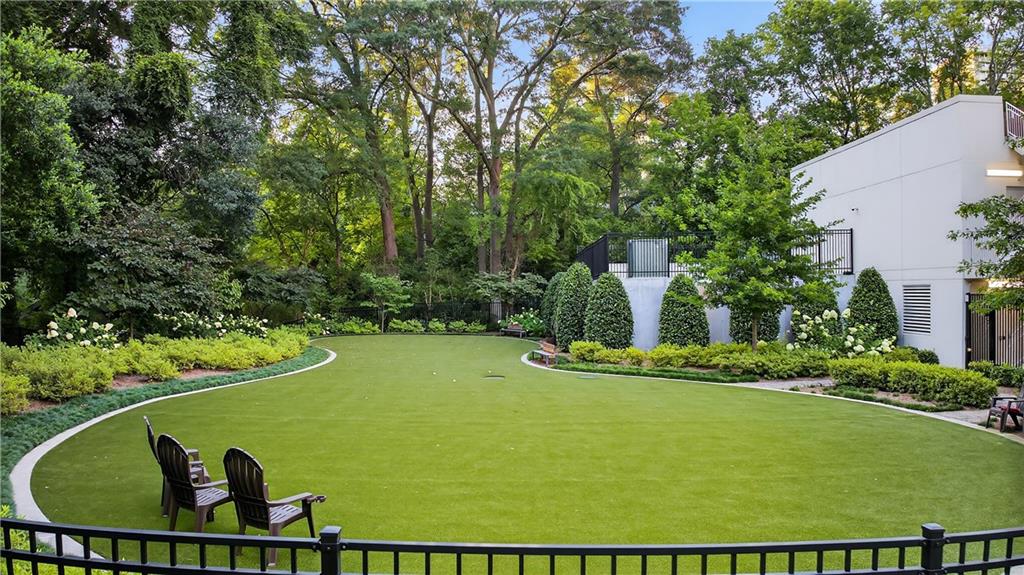 2520 Peachtree Road Northwest, Unit 903 Atlanta, GA 30305 - Photo 49 of 62 a view of a swimming pool with a yard