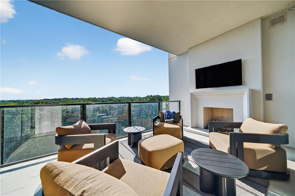 2520 Peachtree Road Northwest, Unit 903 Atlanta, GA 30305 - Photo 5 of 62 a living room with furniture fireplace and a flat screen tv