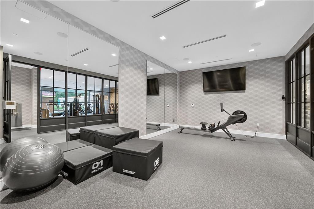 2520 Peachtree Road Northwest, Unit 903 Atlanta, GA 30305 - Photo 53 of 62 a living room with furniture and a flat screen tv