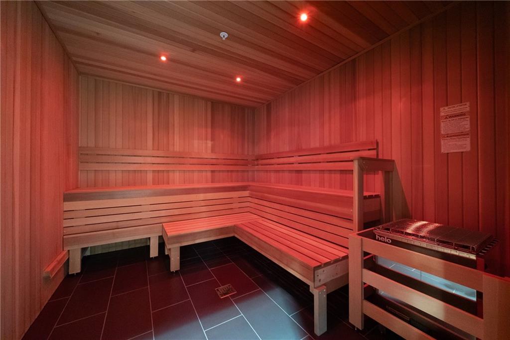 2520 Peachtree Road Northwest, Unit 903 Atlanta, GA 30305 - Photo 55 of 62 a sitting area with wooden cabinets and paintings on the wall