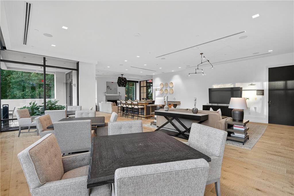 2520 Peachtree Road Northwest, Unit 903 Atlanta, GA 30305 - Photo 57 of 62 a living room with furniture and a flat screen tv