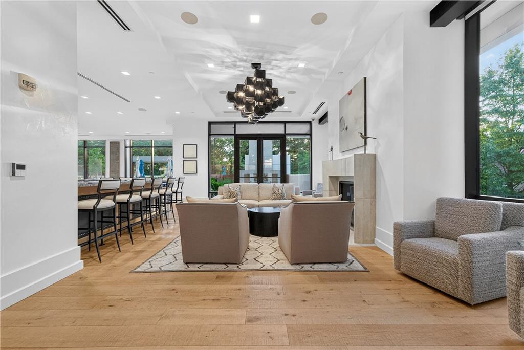 2520 Peachtree Road Northwest, Unit 903 Atlanta, GA 30305 - Photo 59 of 62 a living room with furniture a chandelier and a large window
