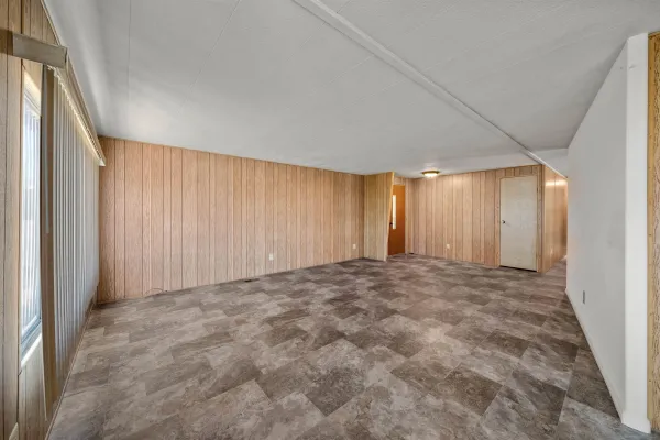 a view of an empty room and window