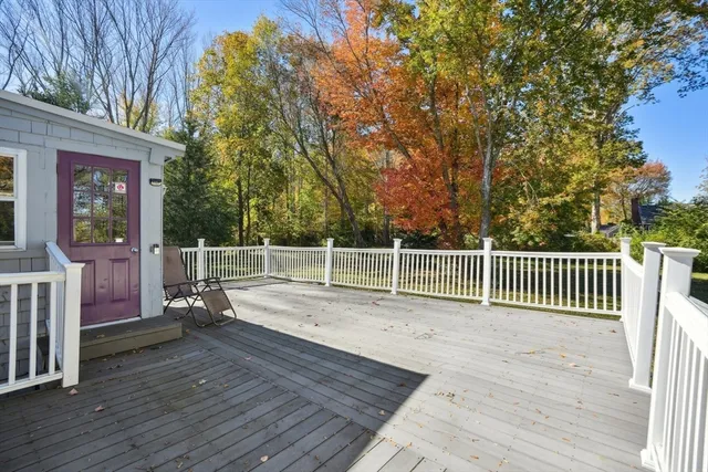 a view of deck with wooden floor and fence
