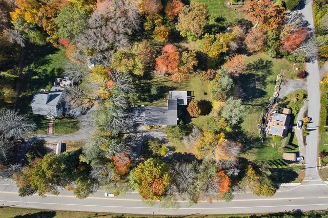 an aerial view of house with yard