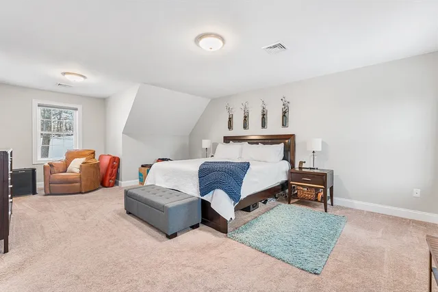 a bedroom with furniture and a couch