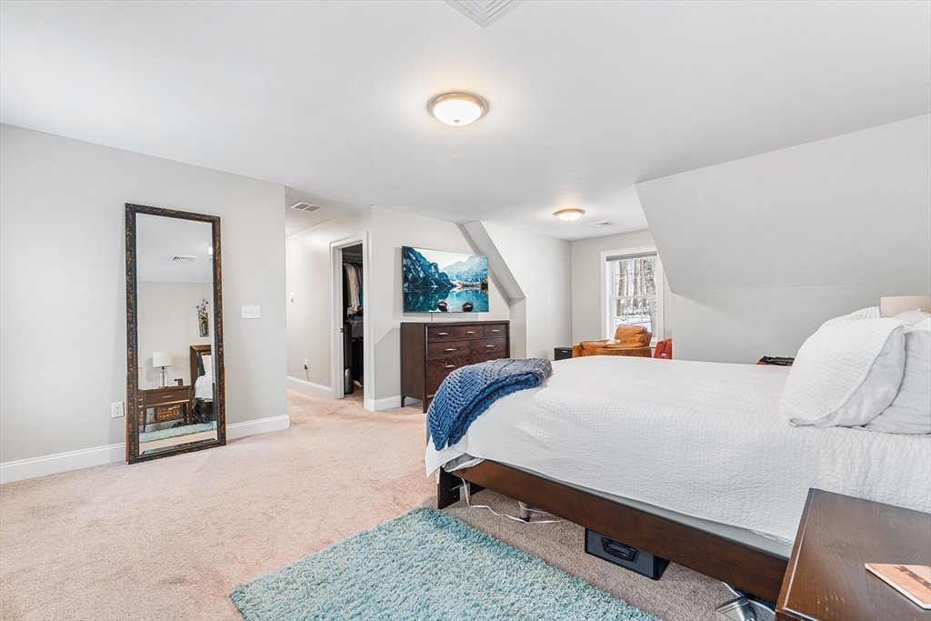 29 Dawley Road Westminster, MA 01473 - Photo 15 of 30 a bedroom with a bed and large mirror