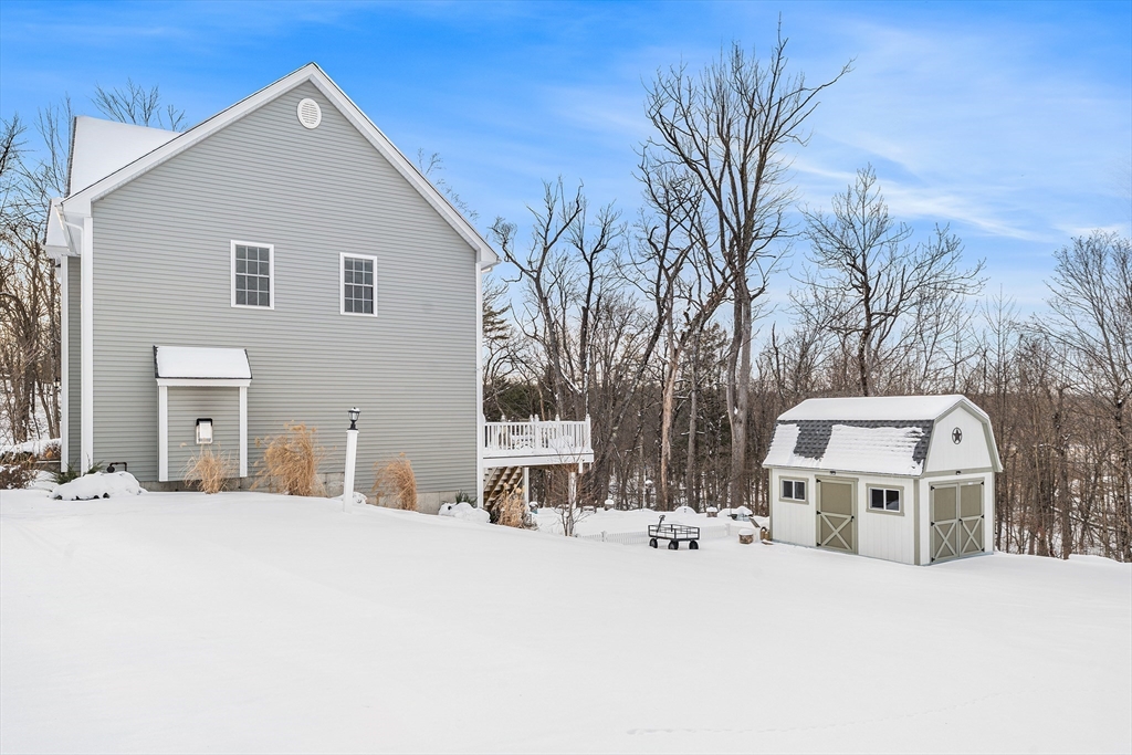 29 Dawley Road Westminster, MA 01473 - Photo 26 of 30 a front view of a house with a yard covered in snow