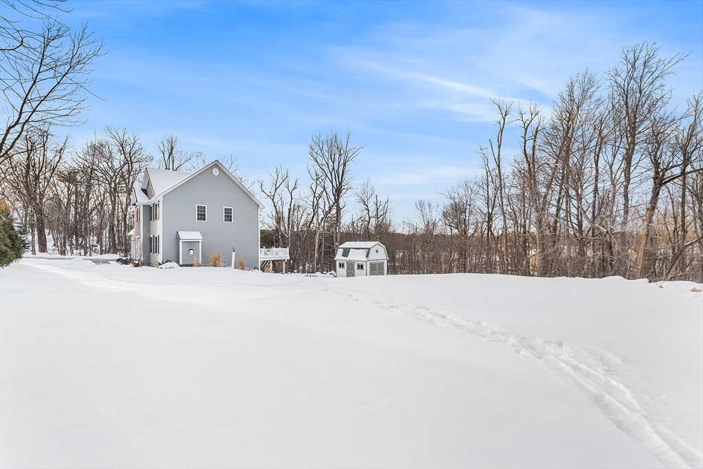 29 Dawley Road Westminster, MA 01473 - Photo 28 of 30 a view of white house with a snow on the road