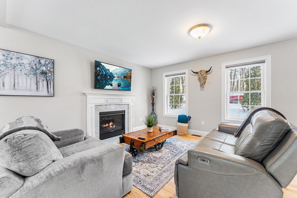 29 Dawley Road Westminster, MA 01473 - Photo 9 of 30 a living room with furniture and a fireplace