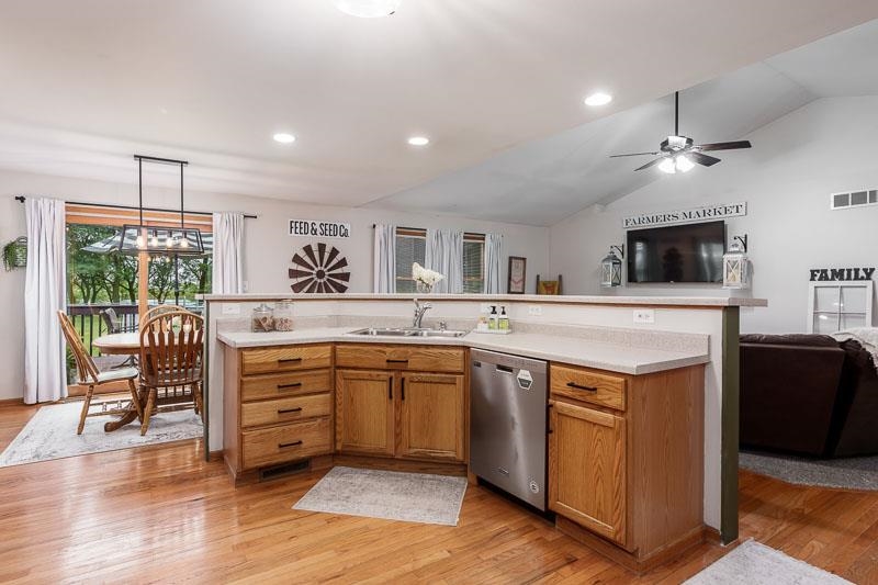 320 Lake Lida Lane Rochelle, IL 61068 - Photo 14 of 43 a kitchen with stainless steel appliances kitchen island granite countertop a stove and a sink