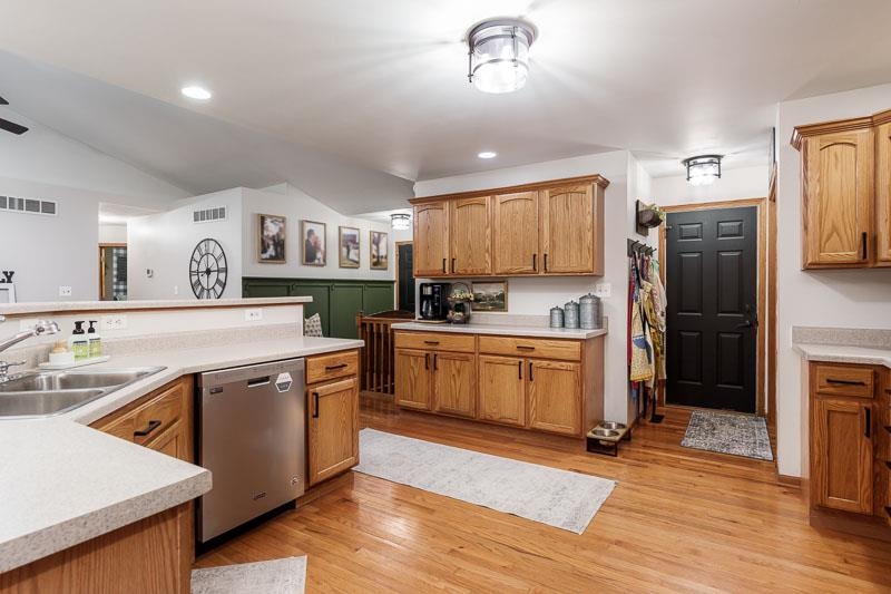 320 Lake Lida Lane Rochelle, IL 61068 - Photo 16 of 43 a kitchen with a sink cabinets stainless steel appliances and a window