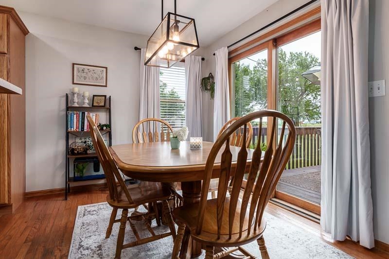 320 Lake Lida Lane Rochelle, IL 61068 - Photo 17 of 43 a view of a dining room with furniture window and wooden floor