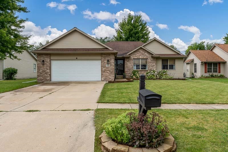 320 Lake Lida Lane Rochelle, IL 61068 - Photo 2 of 43 a front view of a house with a yard