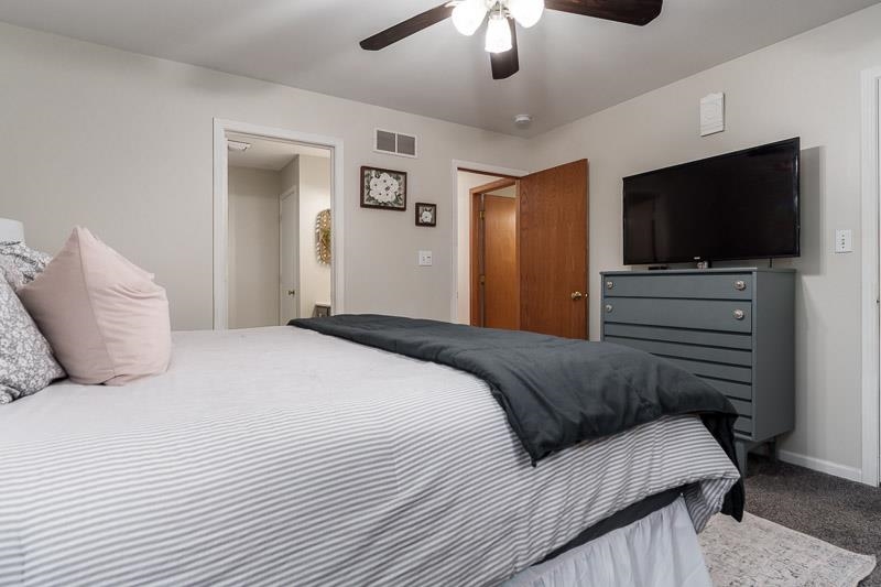 320 Lake Lida Lane Rochelle, IL 61068 - Photo 21 of 43 a bedroom with a bed and a flat screen tv