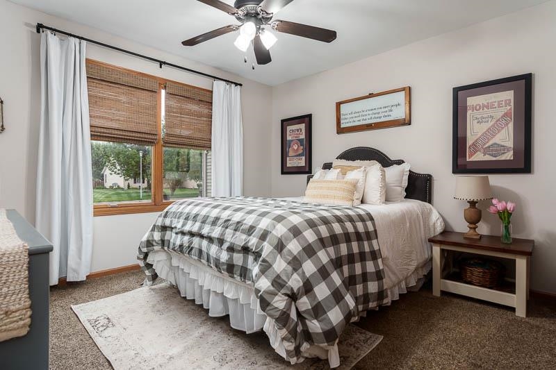 320 Lake Lida Lane Rochelle, IL 61068 - Photo 23 of 43 a bedroom with a bed and a painting on the wall